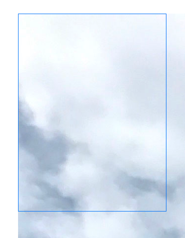 一张图像，显示一个带蓝色边框的框叠加在水车图像之上。图像远大于可用空间，因此只能看到原图左上角的一部分天空和云。图像超出了边框的范围。